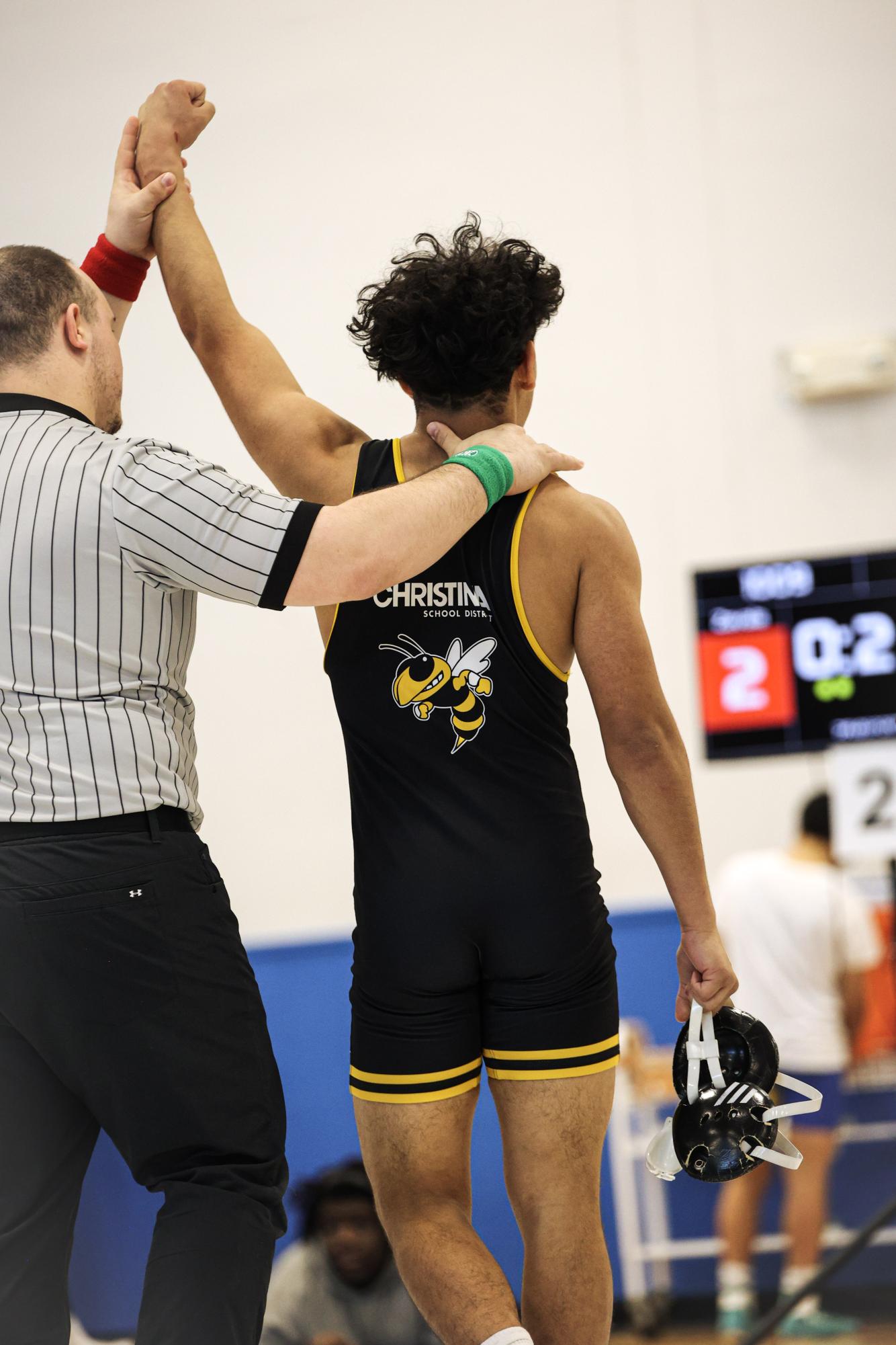 Christian Zavala getting his hand raised after clearing out his bracket for the 138 weight class.